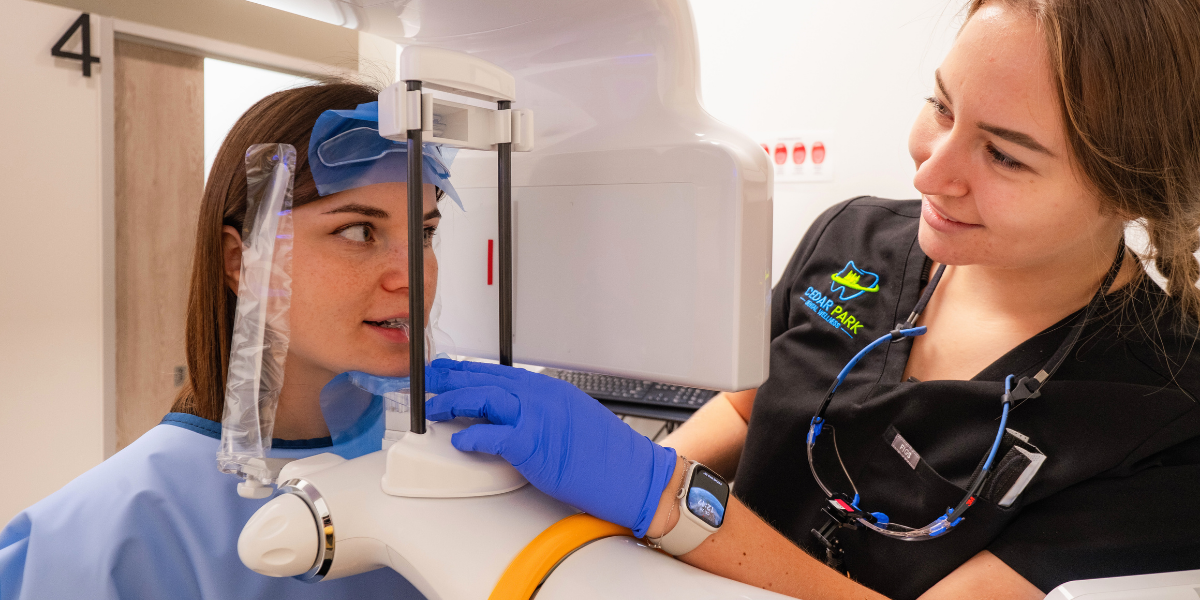 Patient consultation with advanced 3D cone beam dental imaging technology for precise wisdom teeth removal planning